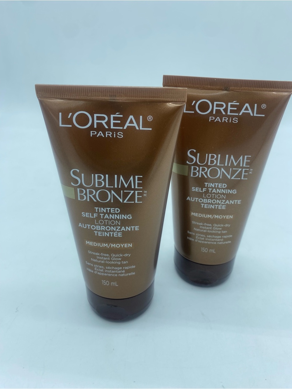 Two L'Oréal Sublime Bronze Tinted Self-Tanning Lotion - Bronze and Gold Accents - Picture 2 of 8